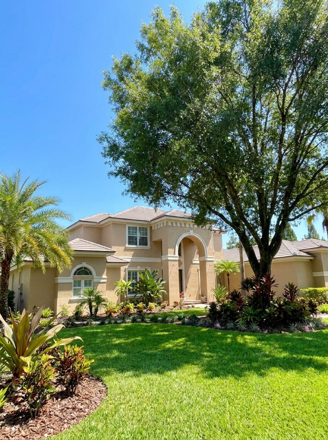 Renovated two-story home exterior with fresh landscaping, Tampa Bay area